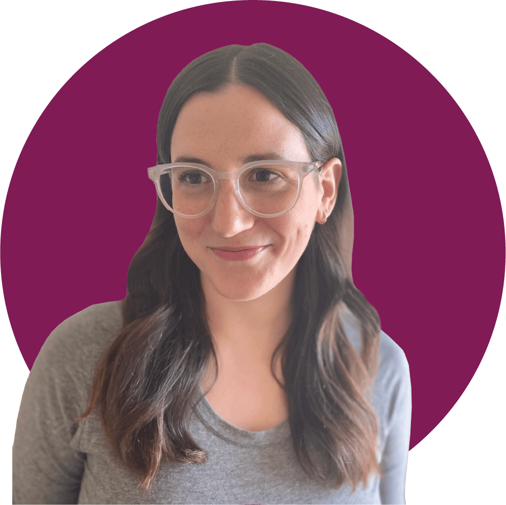 Headshot of Megan Lang, a white woman with long brown hair and glasses.