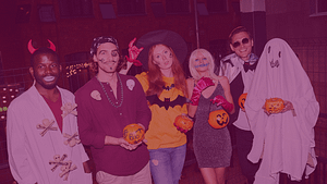 A group of people wearing Halloween costumes.