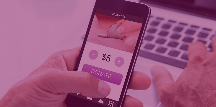 A person making a donation on a smartphone