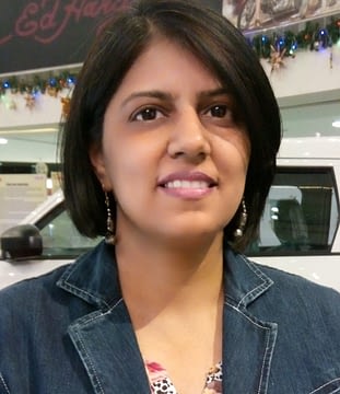 Author photo of an Indian woman with chin length dark hair. She is smiling.