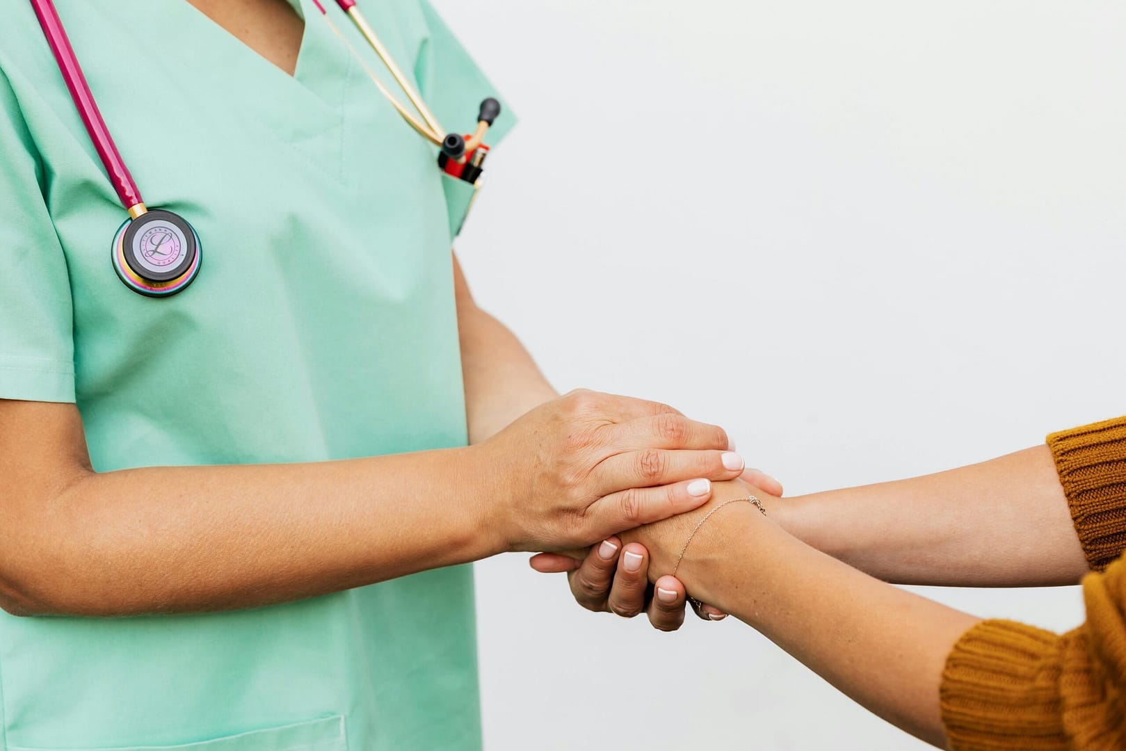 medical practitioner cupping the hands of a patient