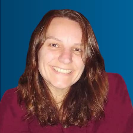 Headshot of Caradwen Braskat, a white person with long brown hair.