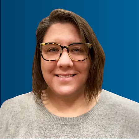 Headshot of Heather Duncan, a white woman with chin length brown hair and tortoiseshell glasses.