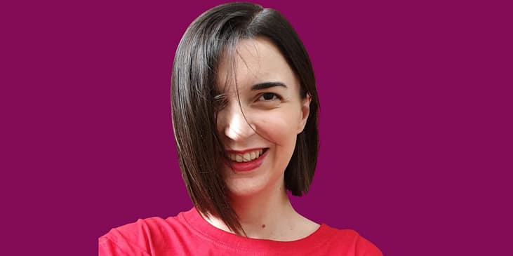 Pauline Castres, a white woman with short brown hair smiles for headshot photo.