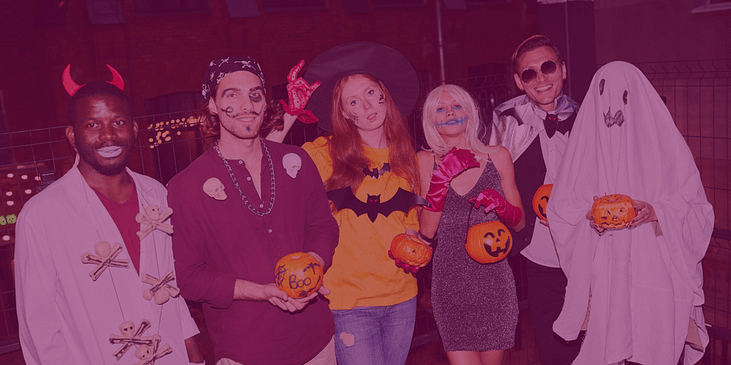 A group of people wearing Halloween costumes.