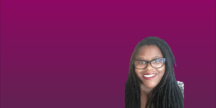 Lorrell Kilpatrick, a Black woman with long dredlocks smiling