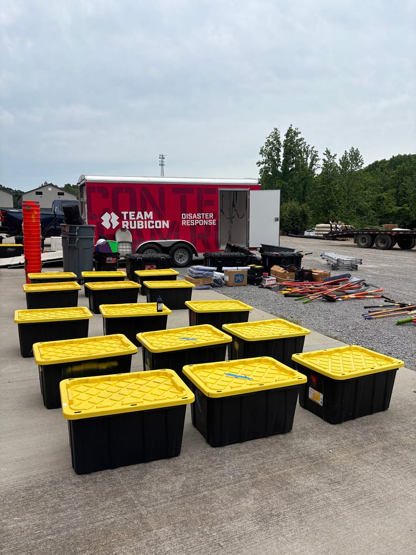Image_20250529_141803_473 Photo of crates and stacks of supplies ready to be loaded in to a Team Rubicon trailer for deployment